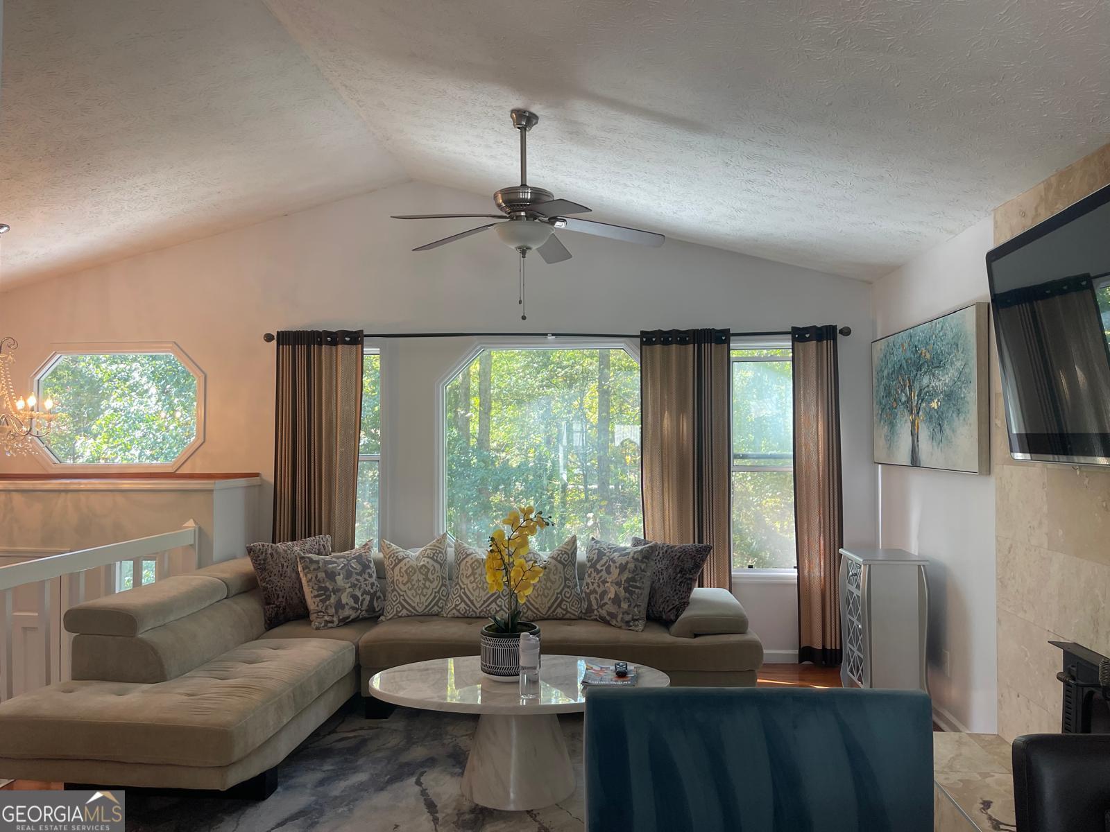 5421 Burdette Road Southeast Mableton, GA 30126 - Photo 22 of 64 a living room with furniture and a large window