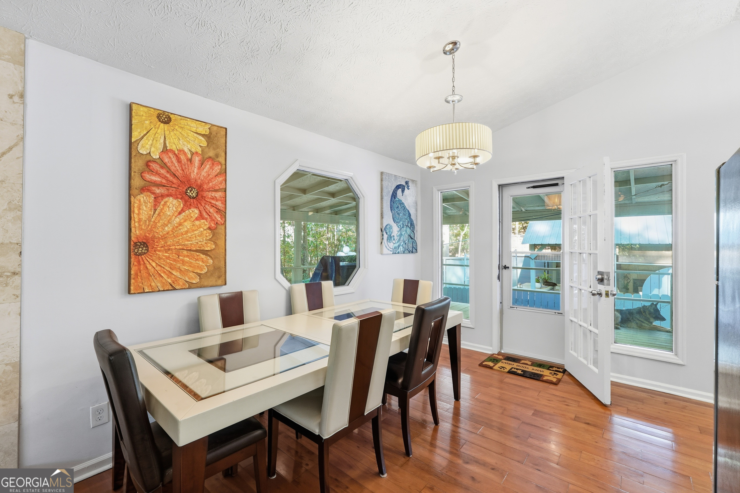 5421 Burdette Road Southeast Mableton, GA 30126 - Photo 34 of 64 a view of a dining room with furniture wooden floor and a chandelier