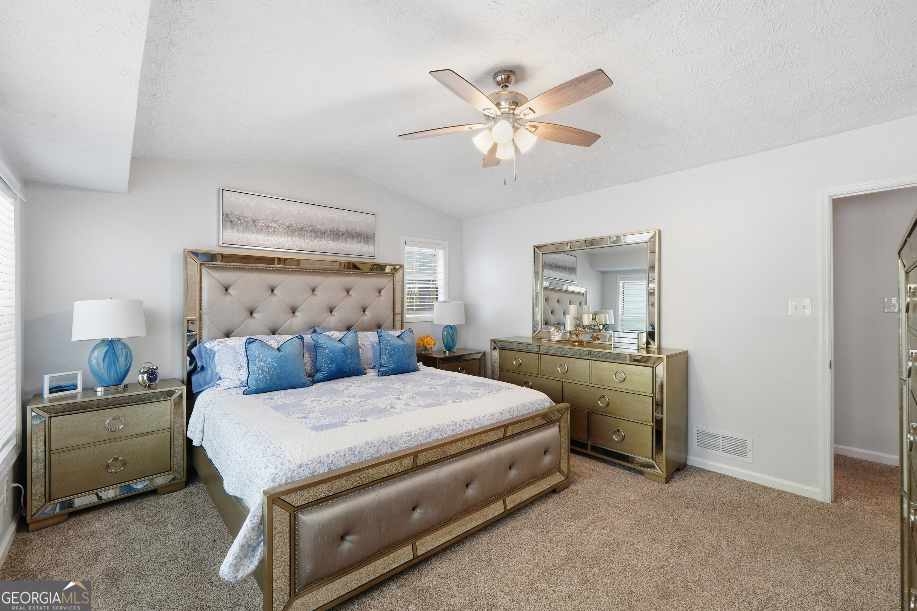 5421 Burdette Road Southeast Mableton, GA 30126 - Photo 37 of 64 a bedroom with a bed and a chandelier