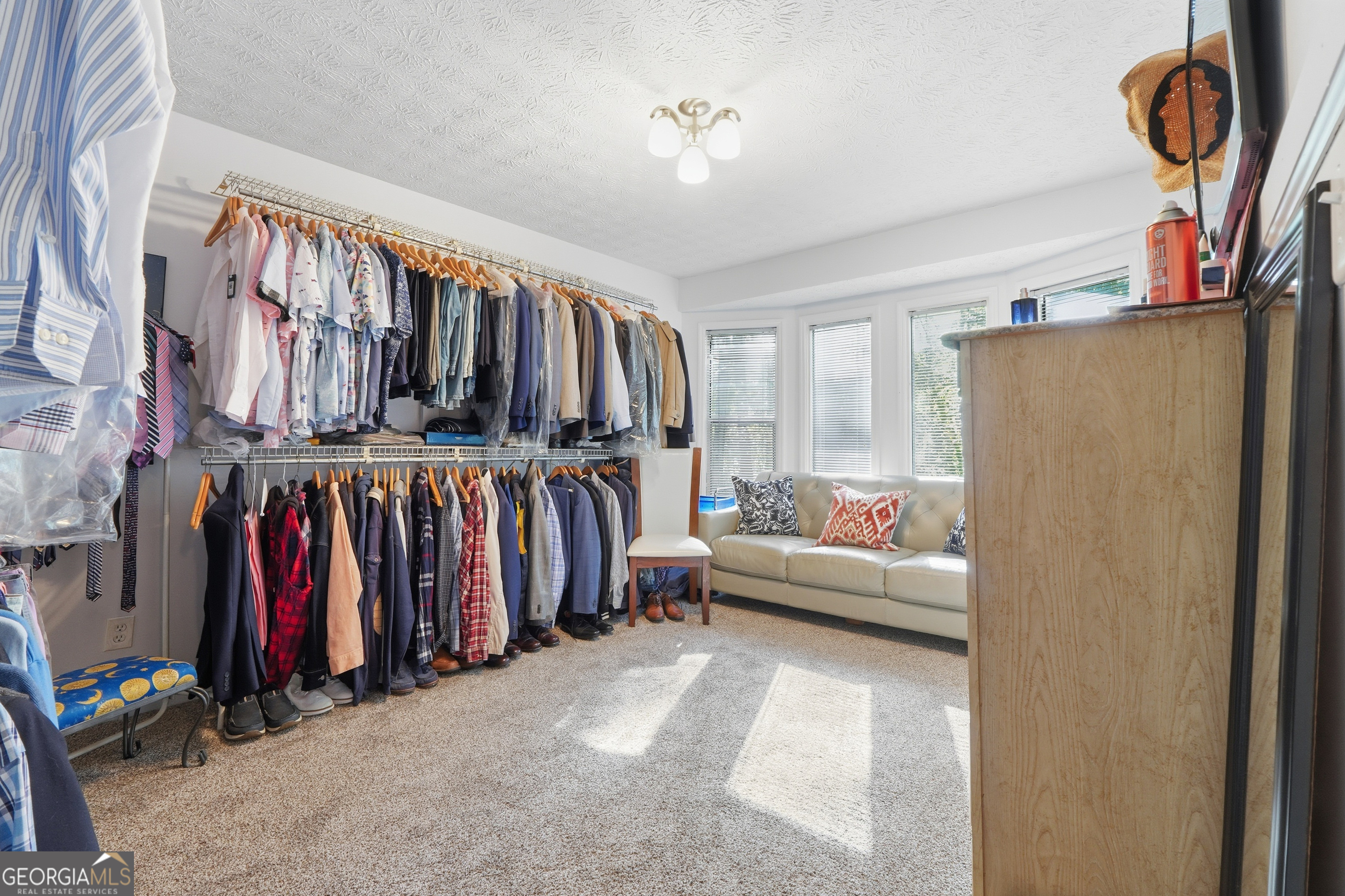 5421 Burdette Road Southeast Mableton, GA 30126 - Photo 39 of 64 a view of walk in closet with clothes and shoes