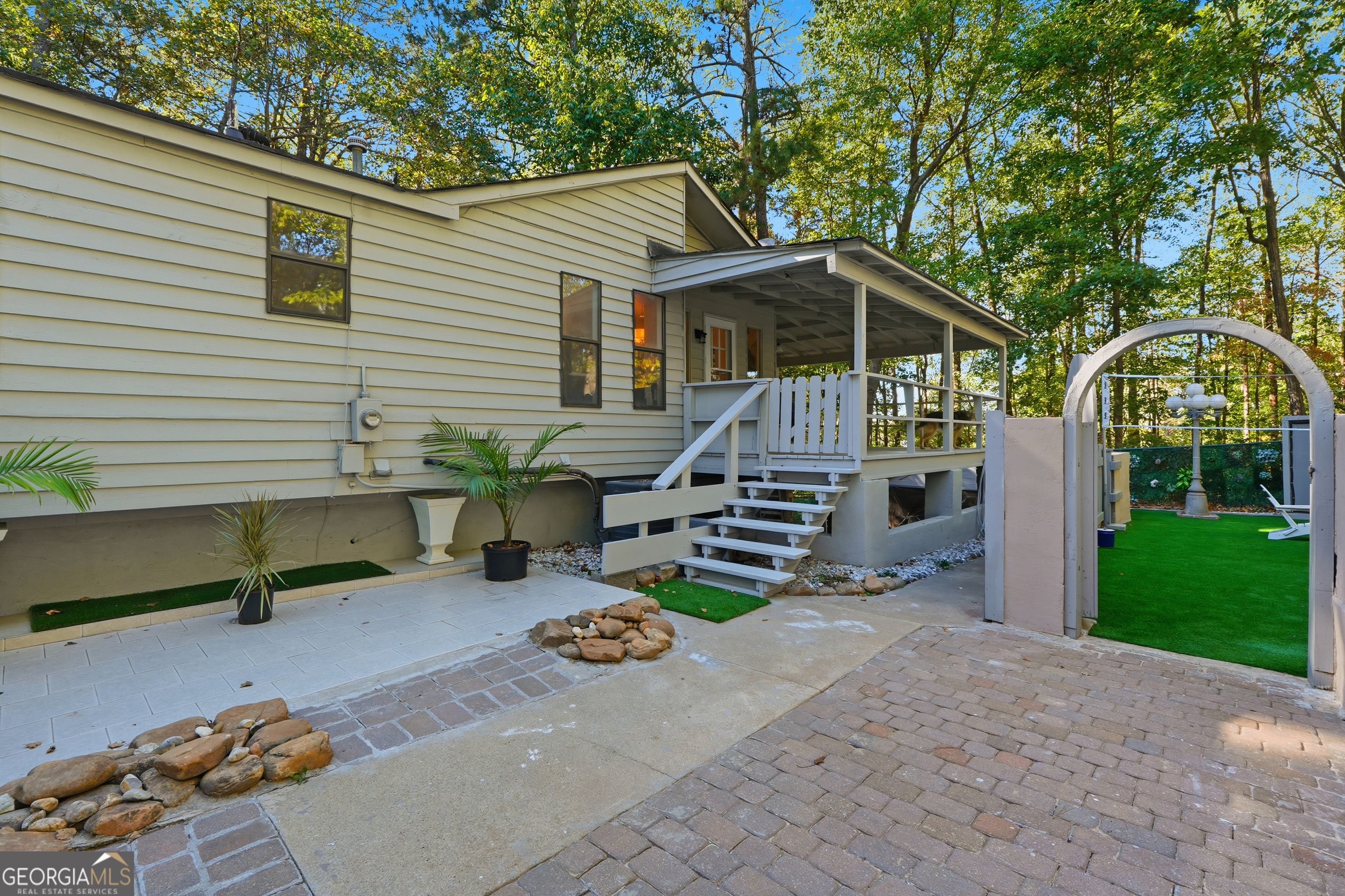 5421 Burdette Road Southeast Mableton, GA 30126 - Photo 48 of 64 a view of a chair and table in backyard of the house