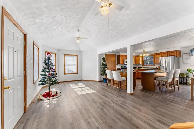 a view of a livingroom with furniture and hardwood floor
