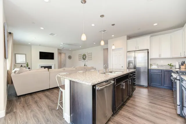 a kitchen with a sink and a refrigerator