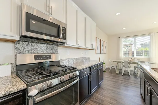 a kitchen with a stove and a microwave