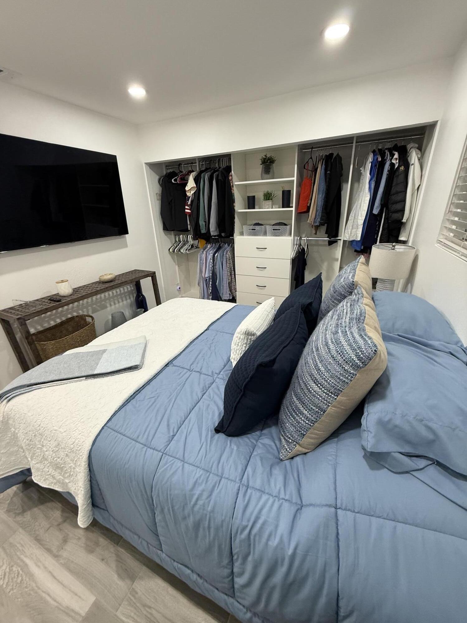 37081 Palmdale Road Rancho Mirage, CA 92270 - Photo 30 of 46 a bedroom with a bed window and walk in closet