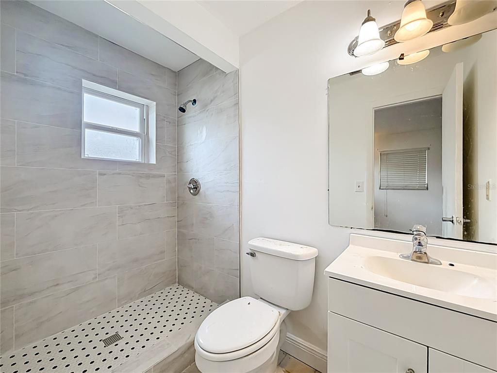 3 Bahia Pl Loop Ocala, FL 34472 - Photo 26 of 31 a bathroom with a sink a toilet and shower