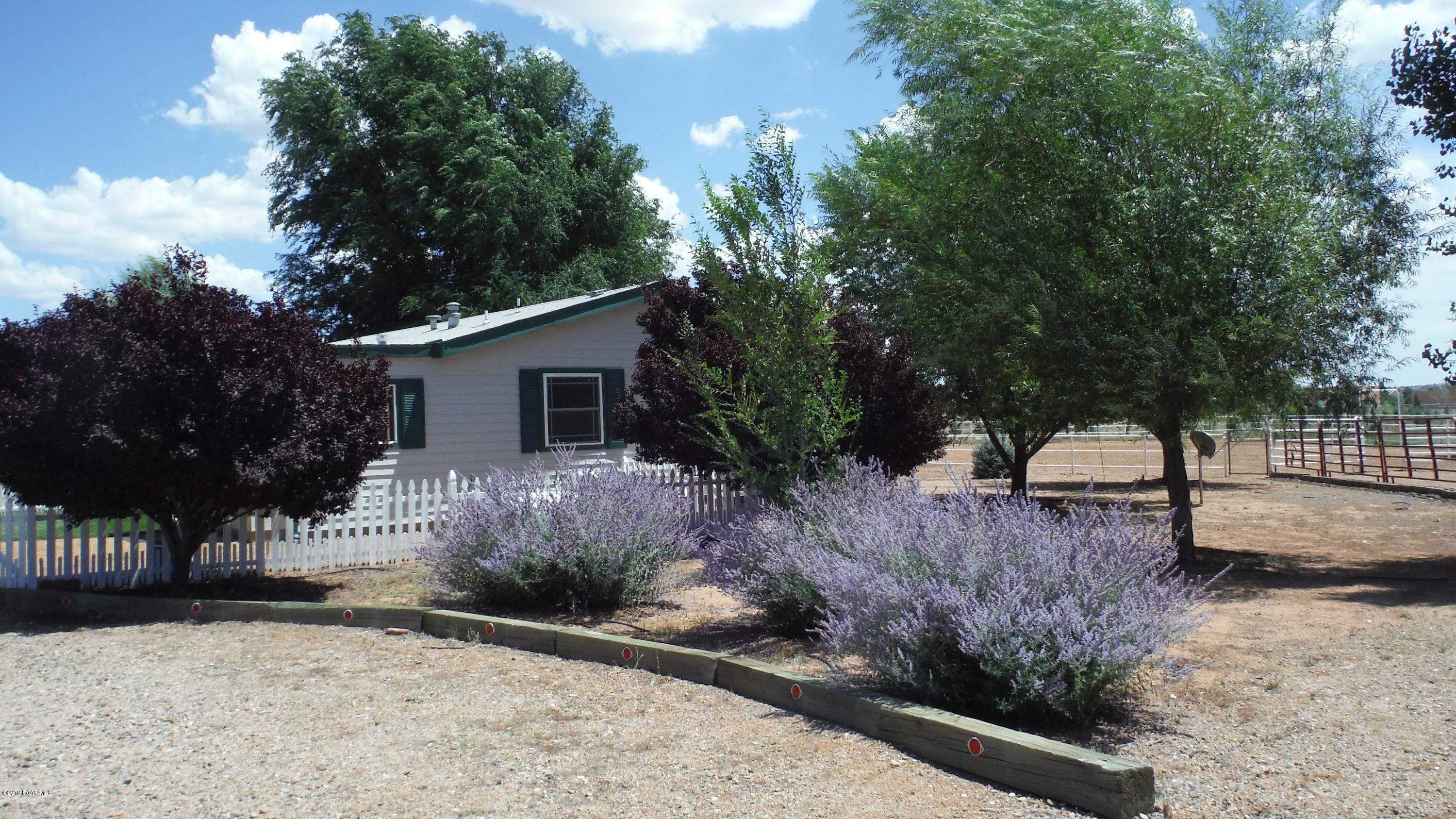 25356 North High Desert Road Paulden, AZ 86334 - Photo 19 of 56 a view of a house with a yard and tree