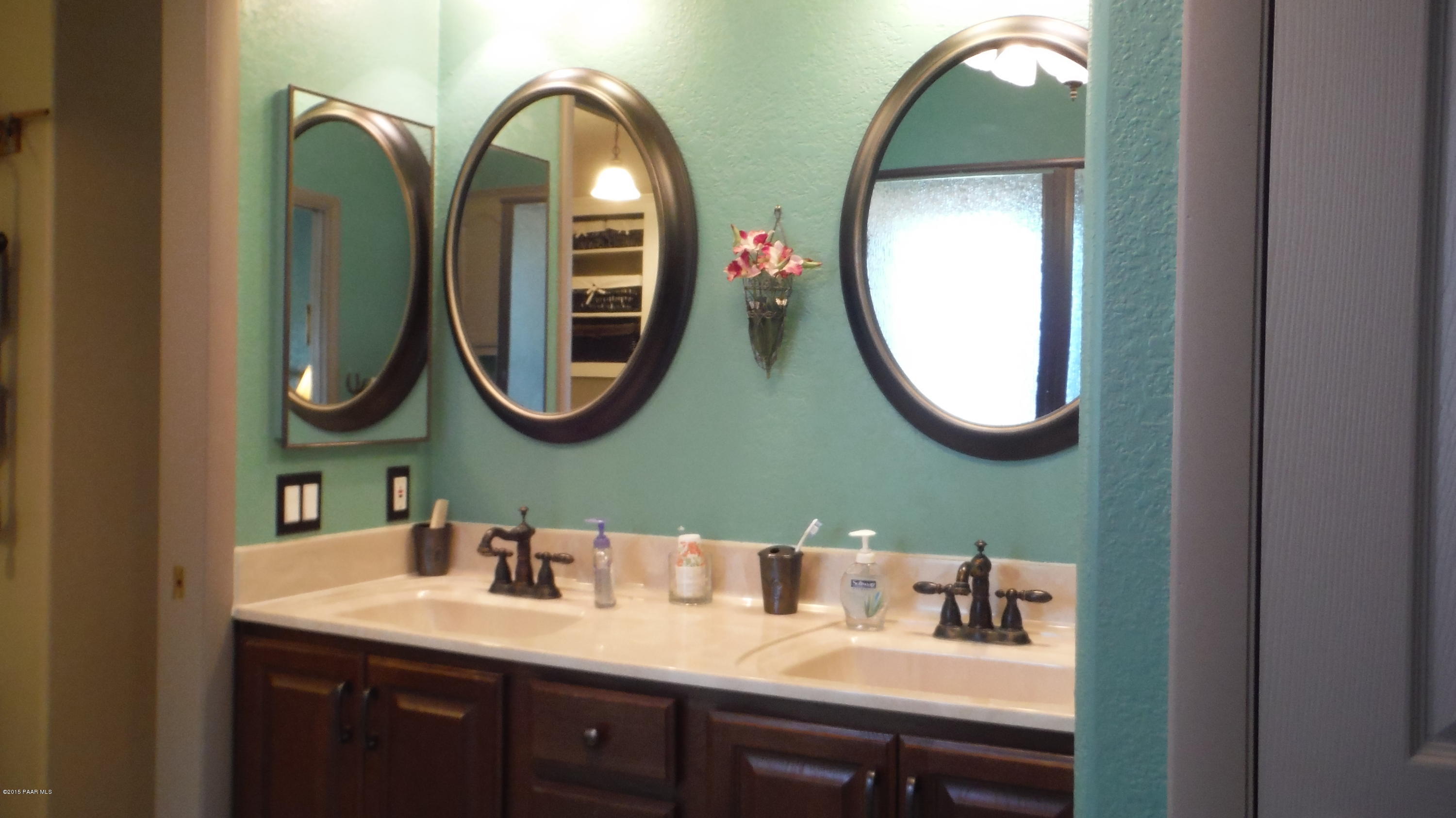 25356 North High Desert Road Paulden, AZ 86334 - Photo 30 of 56 a bathroom with a mirror and sink