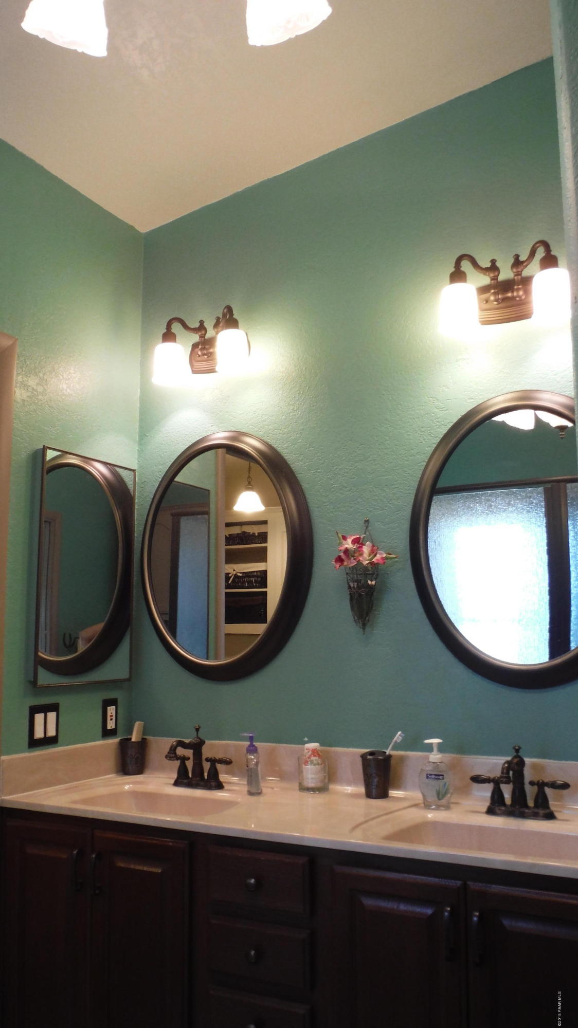 25356 North High Desert Road Paulden, AZ 86334 - Photo 31 of 56 a bathroom with a double vanity sink and a mirror