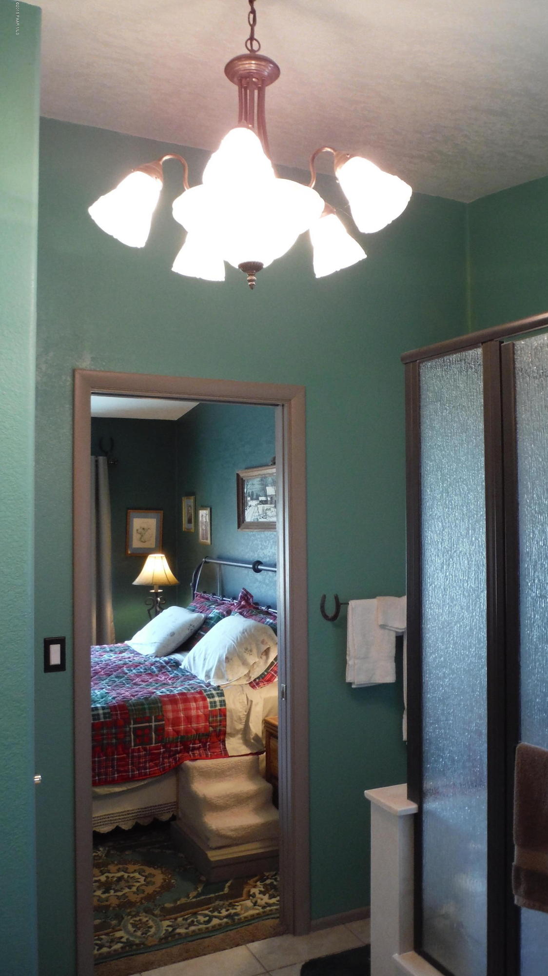 25356 North High Desert Road Paulden, AZ 86334 - Photo 33 of 56 a bedroom with a bed and wooden floor