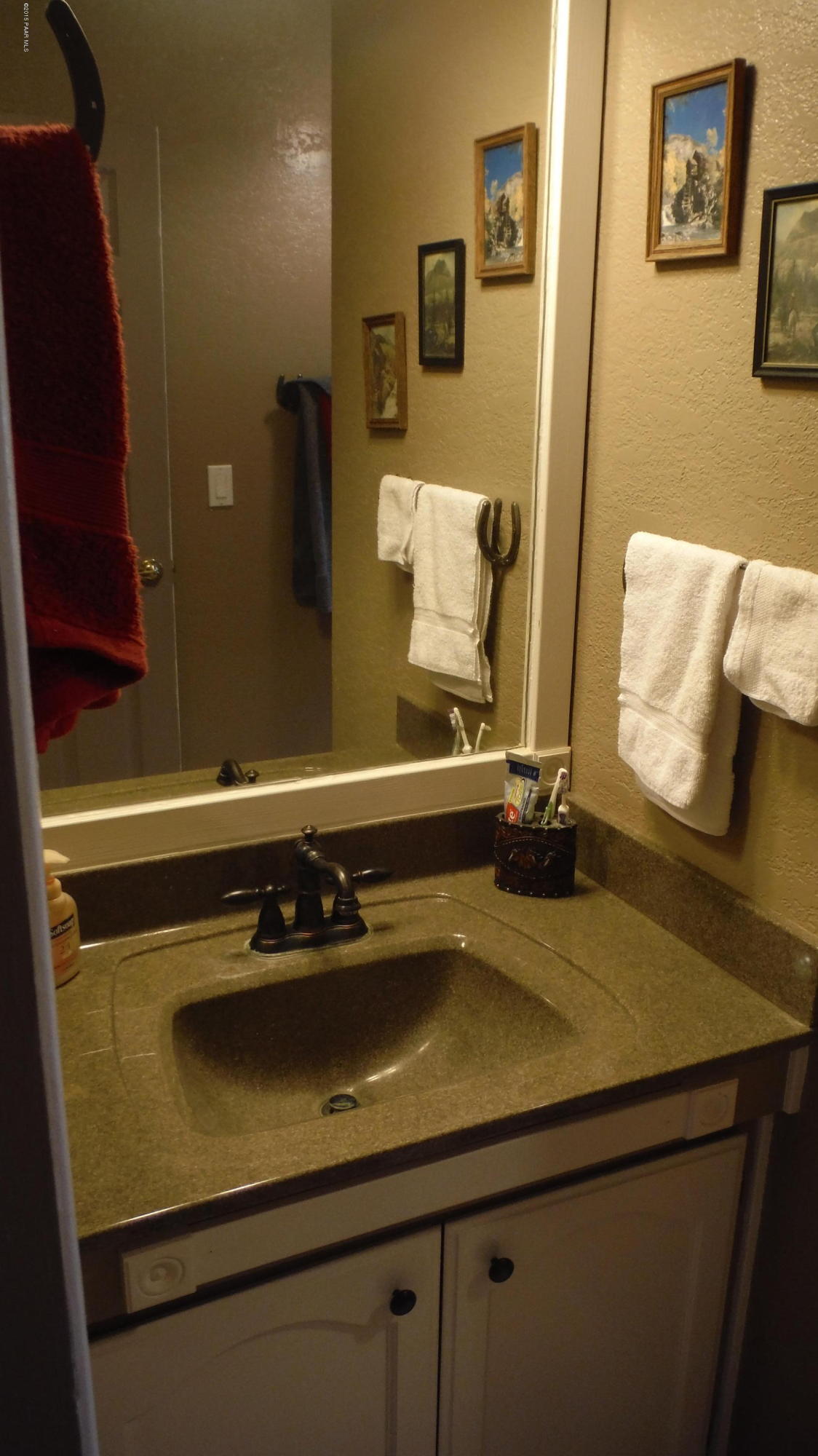 25356 North High Desert Road Paulden, AZ 86334 - Photo 37 of 56 a room with a sink and a mirror