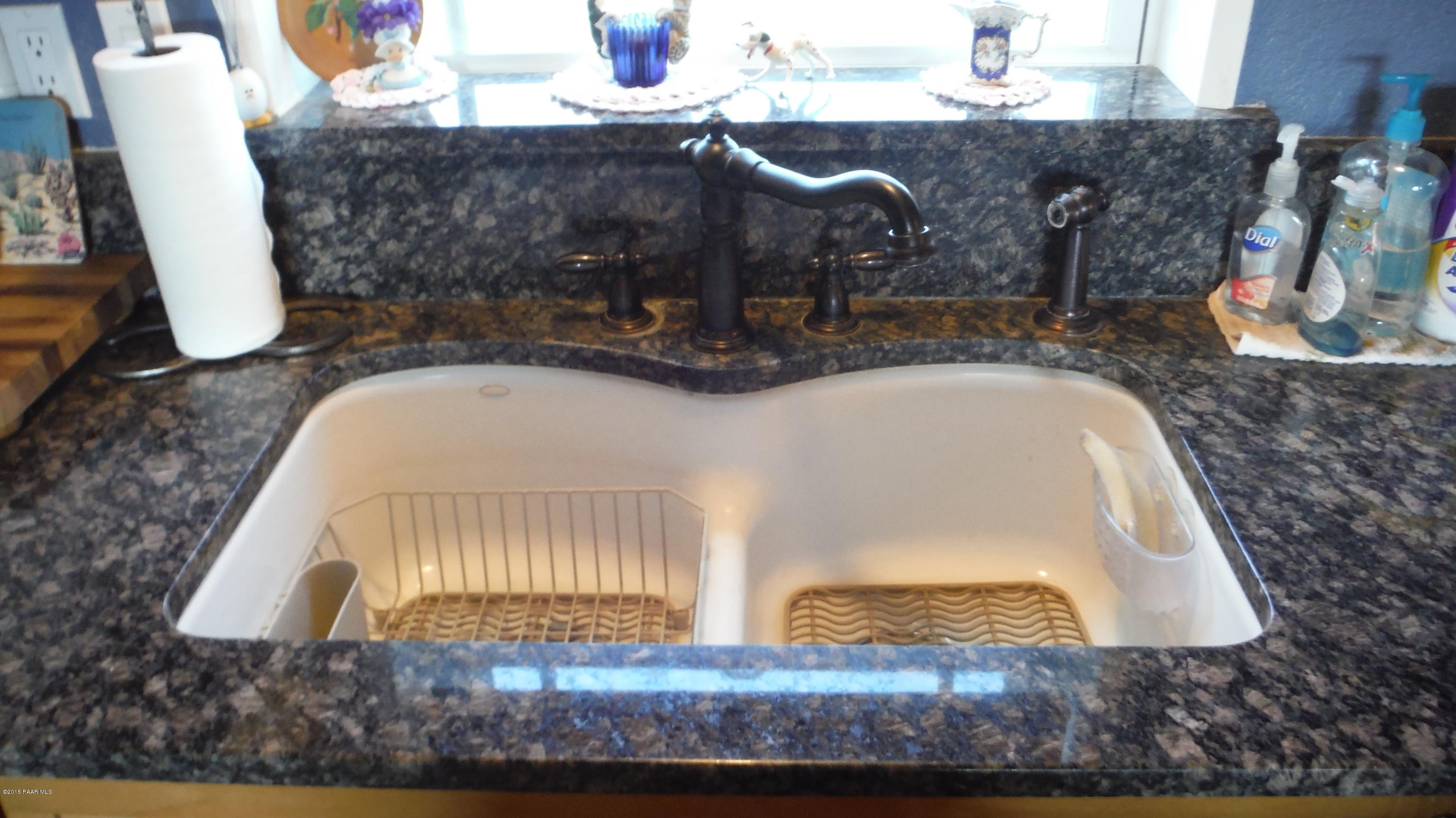 25356 North High Desert Road Paulden, AZ 86334 - Photo 42 of 56 a bathroom with a granite countertop sink and a mirror