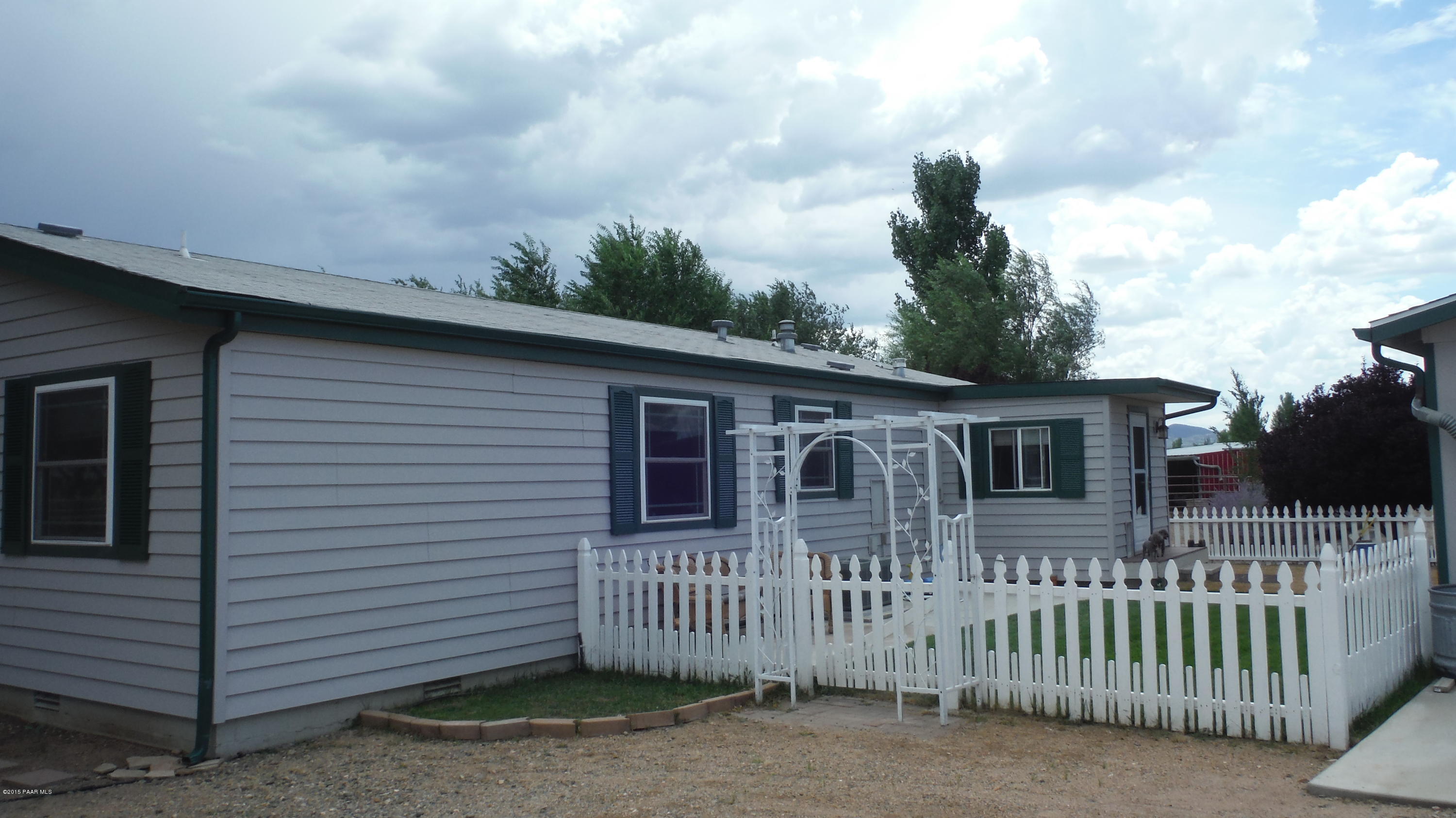 25356 North High Desert Road Paulden, AZ 86334 - Photo 49 of 56 a front view of a house with a yard