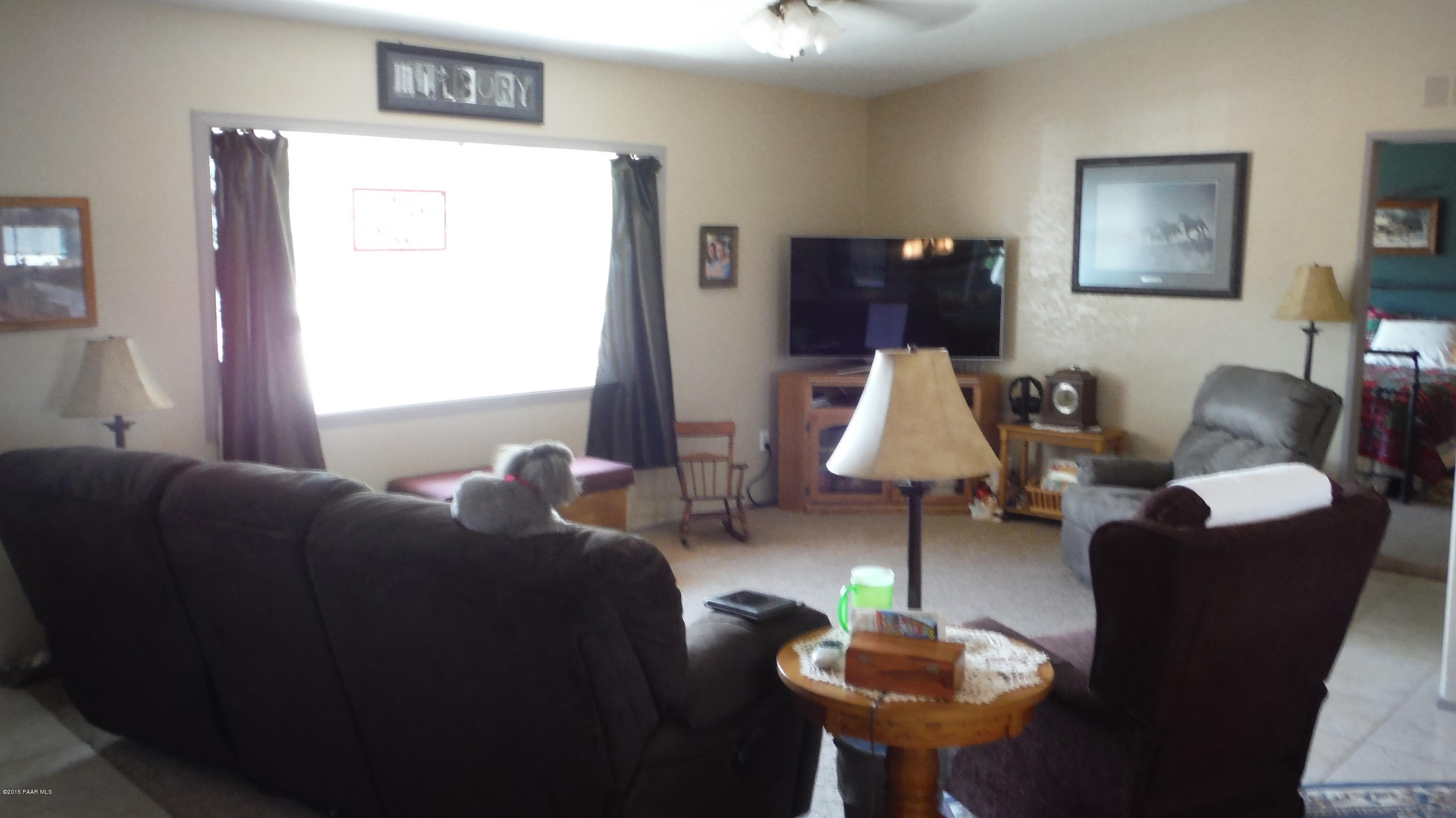 25356 North High Desert Road Paulden, AZ 86334 - Photo 5 of 56 a living room with furniture and a lamp