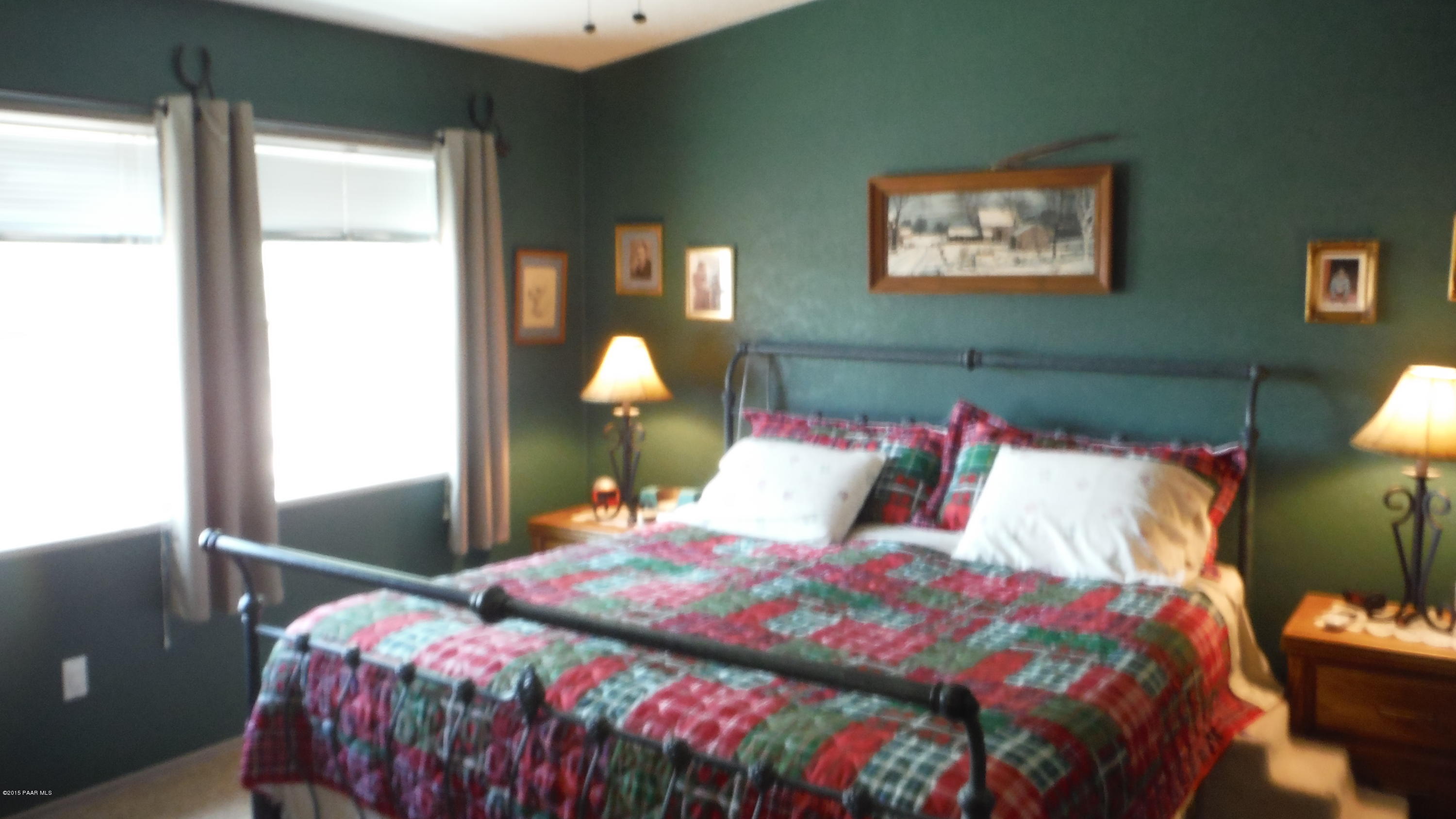 25356 North High Desert Road Paulden, AZ 86334 - Photo 7 of 56 a bedroom with bed and a window