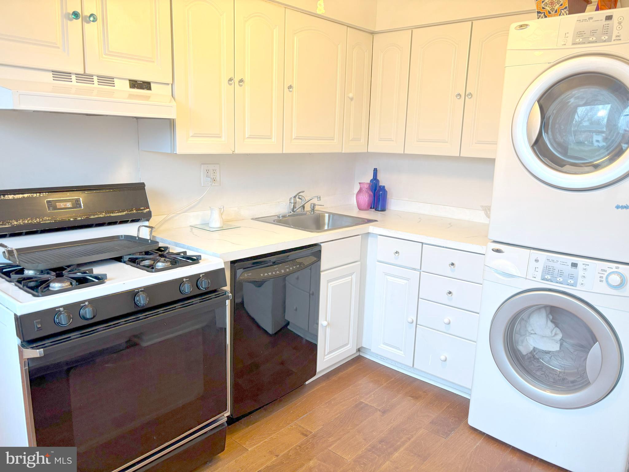 52 Michael Road Hammonton, NJ 08037 - Photo 6 of 30 a kitchen with a stove top oven sink and cabinets