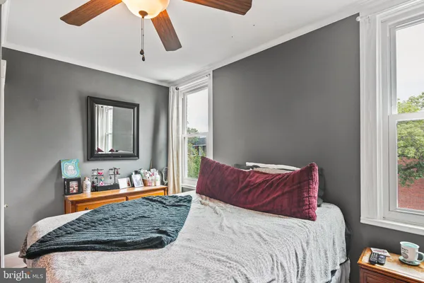 a bedroom with a bed and window