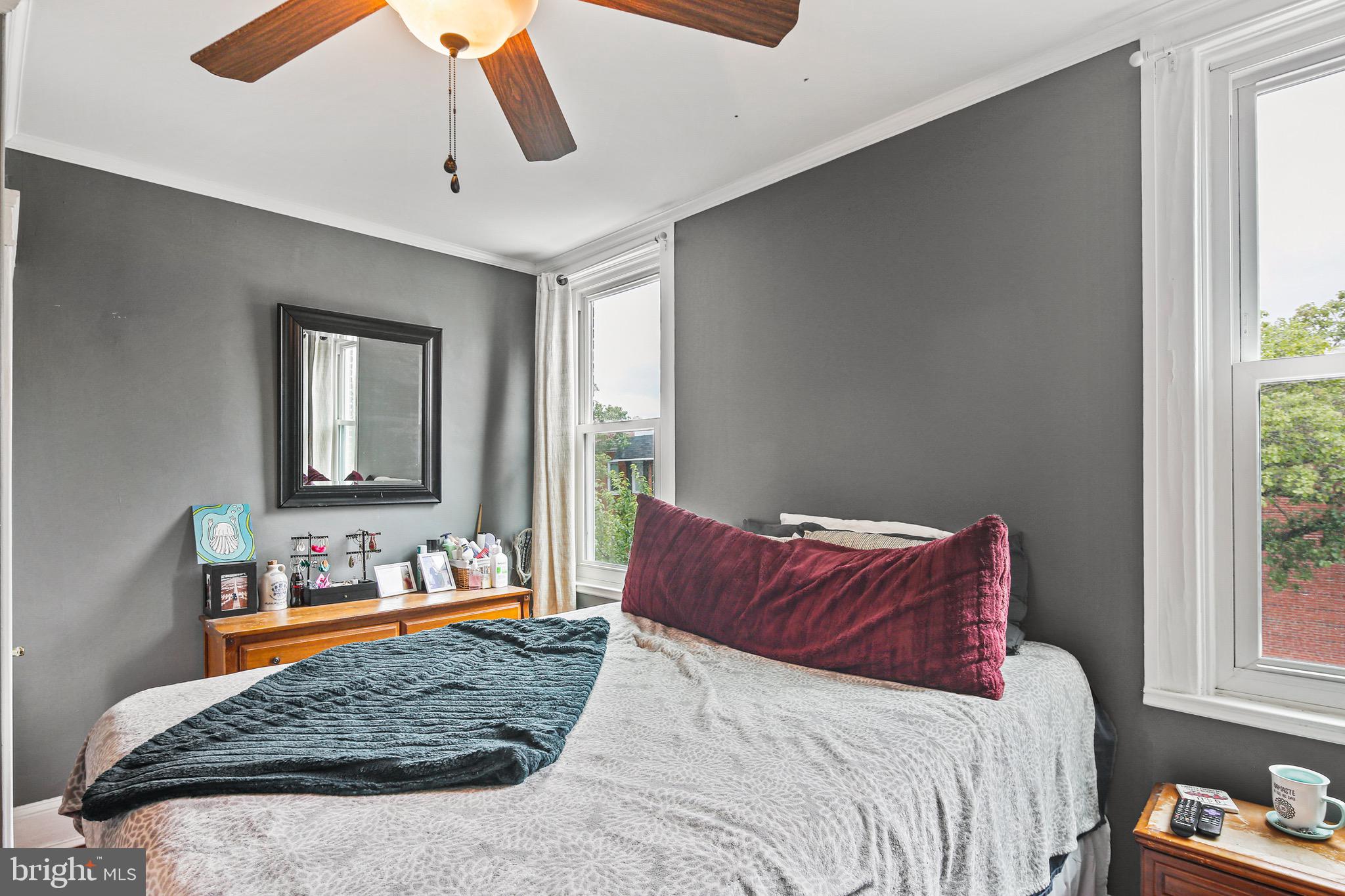 701 Grundy Street Baltimore, MD 21224 - Photo 14 of 22 a bedroom with a bed and window