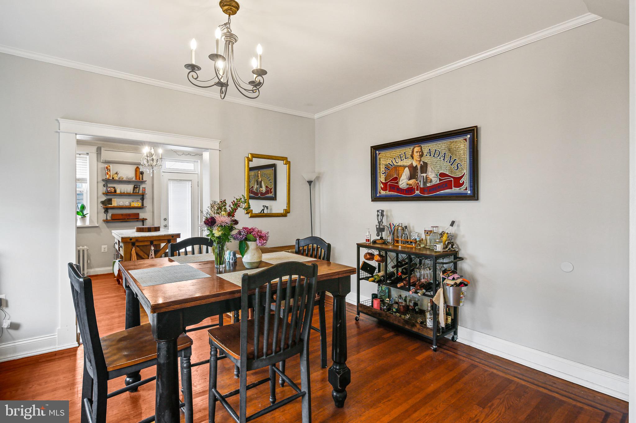 701 Grundy Street Baltimore, MD 21224 - Photo 5 of 22 a view of a dining room with furniture and wooden floor