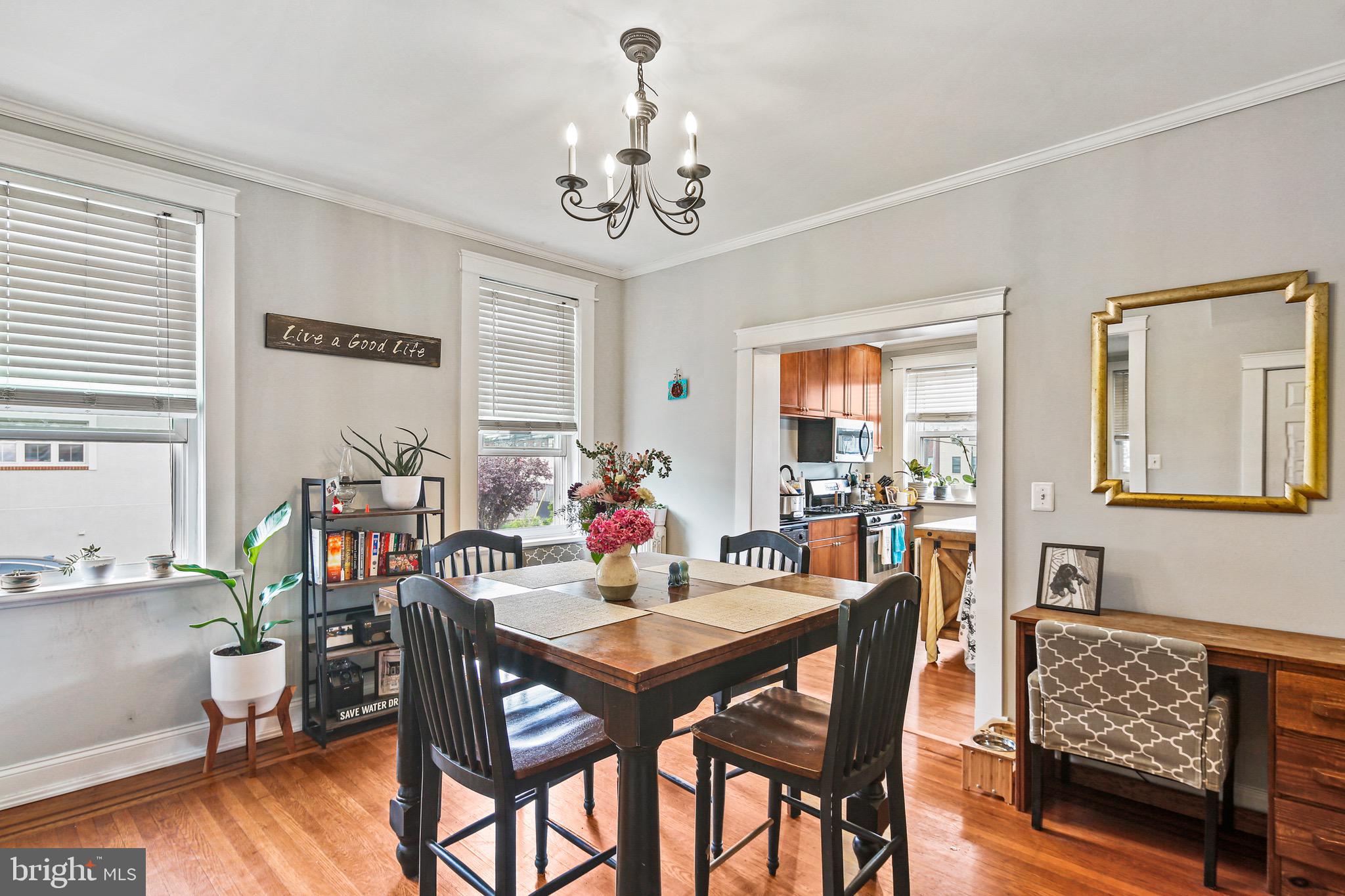 701 Grundy Street Baltimore, MD 21224 - Photo 6 of 22 a view of a dining room with furniture window and wooden floor