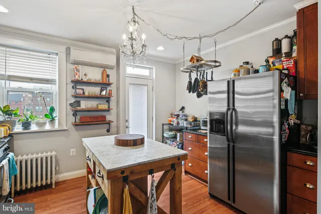 a kitchen with refrigerator and window