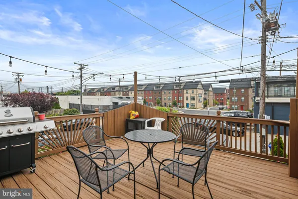 a view of a balcony with furniture