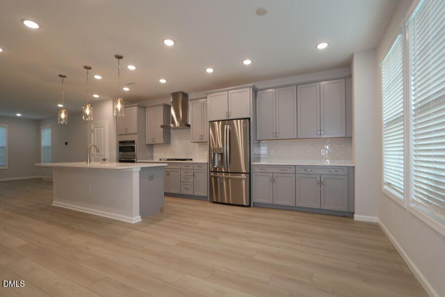 2913 Richardson Road, Unit 475 Apex, NC 27502 - Photo 10 of 24 a kitchen with a refrigerator and a sink