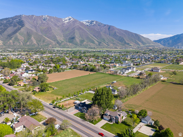 1285 West Maple Street Mapleton, UT 84664 - Photo 28 of 35 Expansive mountain range backdrop framing a residential area with varied housing styles