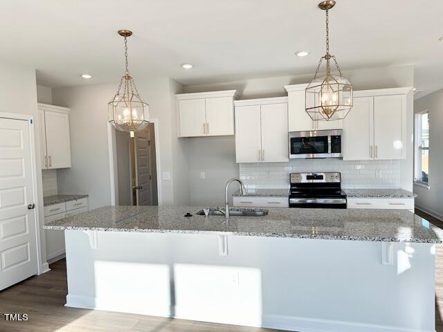 36 Ripple Way, Unit 295 Clayton, NC 27520 - Photo 2 of 17 Bright white Kitchen as of 1/21/24