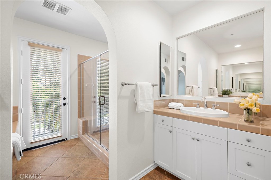 47 Tuscany Ladera Ranch, CA 92694 - Photo 15 of 28 a spacious bathroom with a double vanity sink mirror and shower