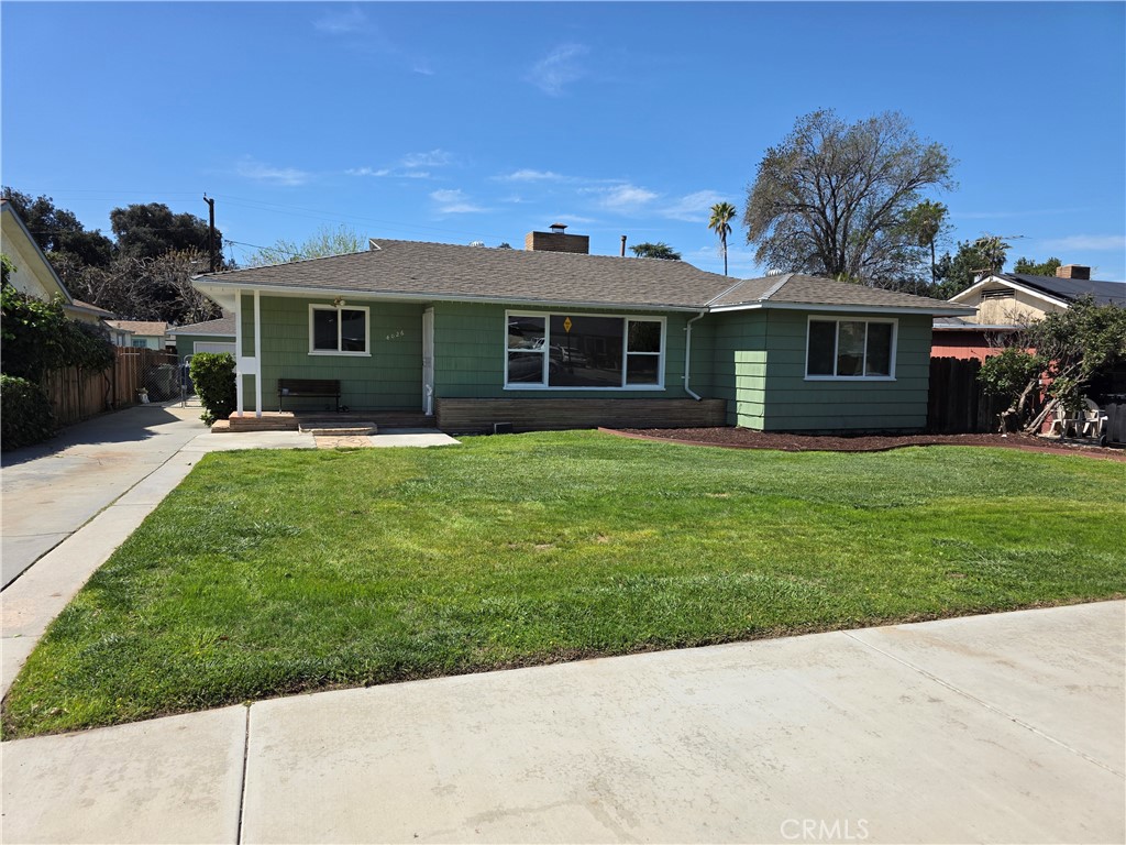 4026 Acacia Street Riverside, CA 92503 - Photo 1 of 1 a front view of house with yard and green space