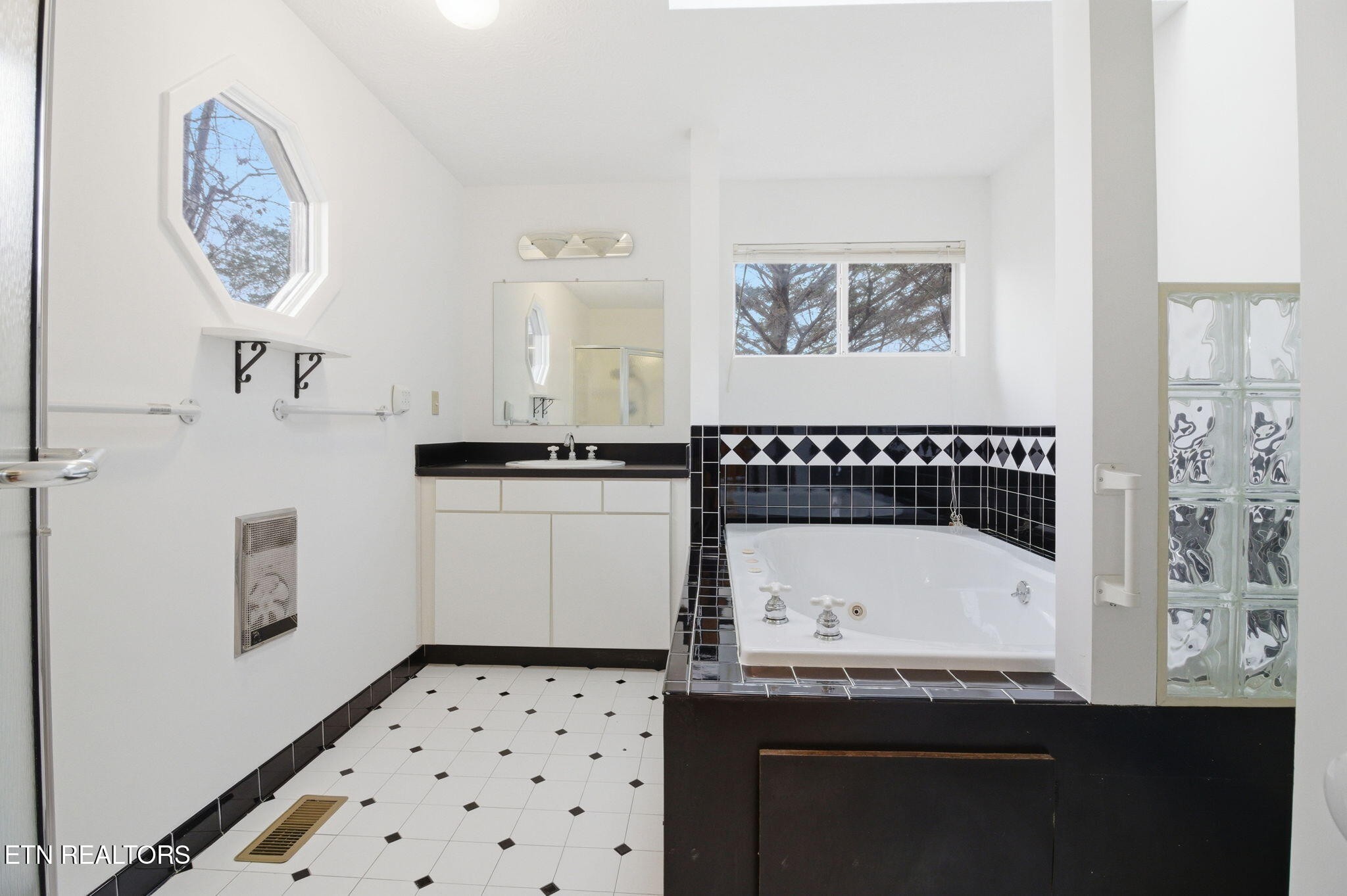 353 East Wolf Valley Road Heiskell, TN 37754 - Photo 13 of 34 a bathroom with a sink and a mirror