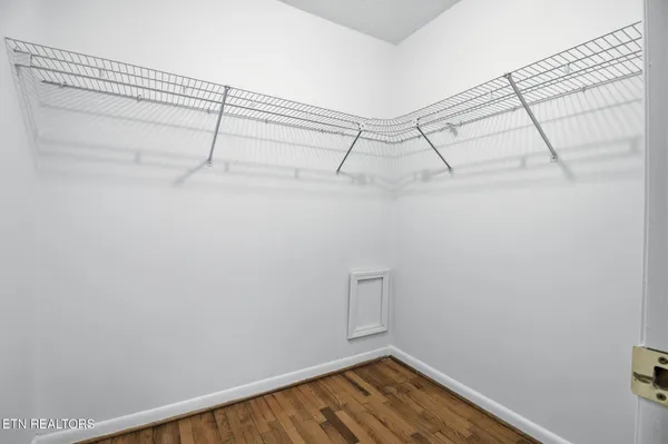 a room with furniture and wooden floor