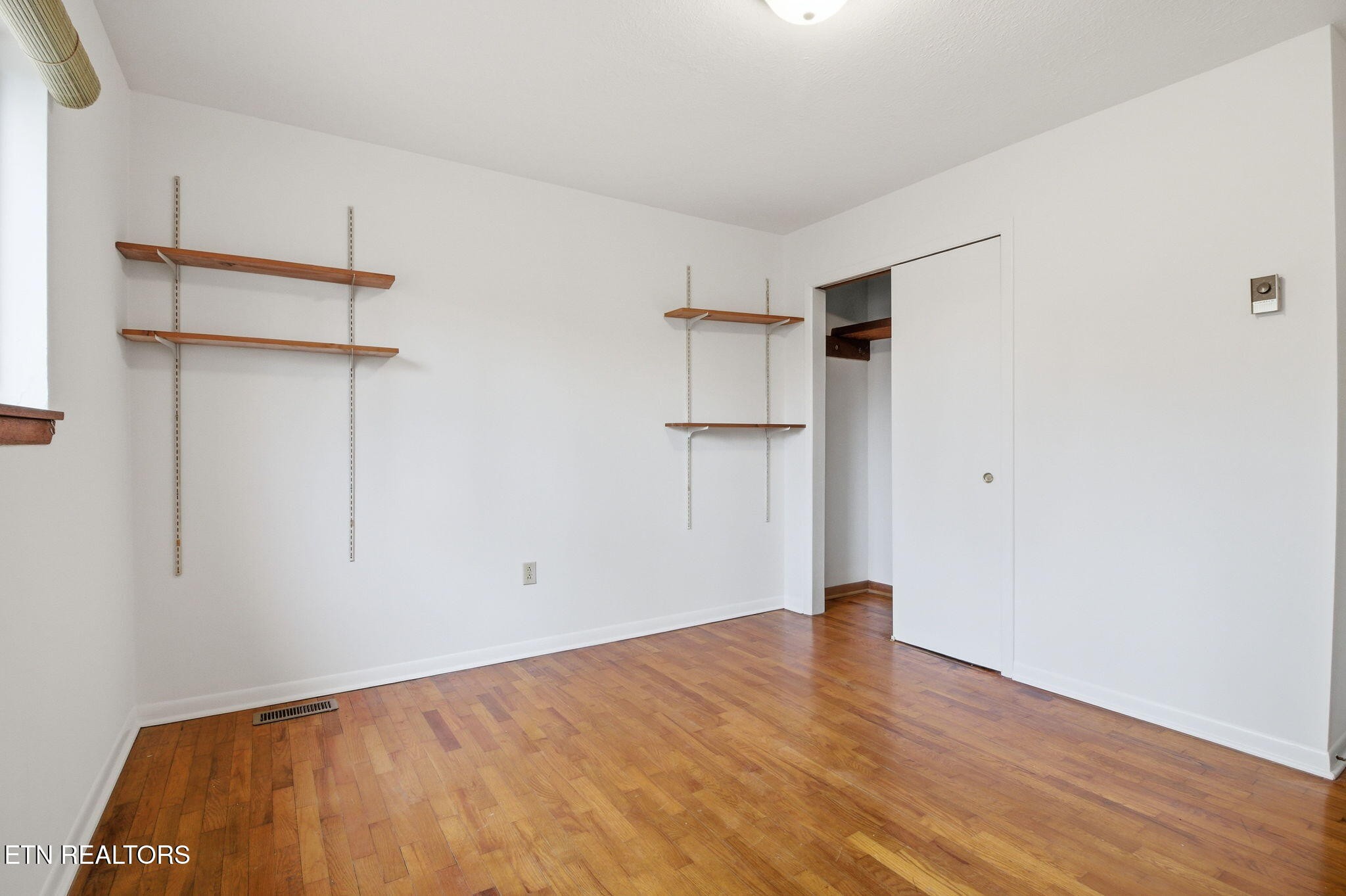 353 East Wolf Valley Road Heiskell, TN 37754 - Photo 20 of 34 a view of empty room with wooden floor