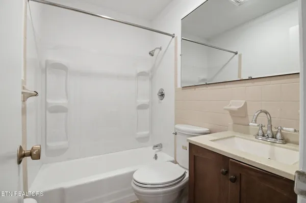 a view of two chairs in the balcony