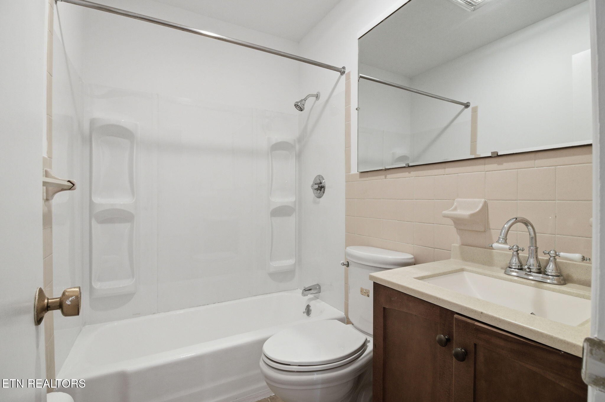 353 East Wolf Valley Road Heiskell, TN 37754 - Photo 22 of 34 a bathroom with a granite countertop sink a toilet and shower