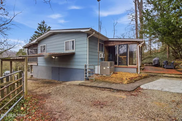 a house with trees in the background