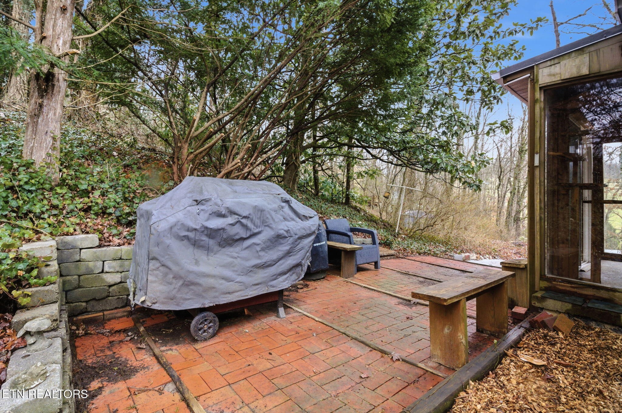 353 East Wolf Valley Road Heiskell, TN 37754 - Photo 30 of 34 a view of a backyard with sitting area and furniture
