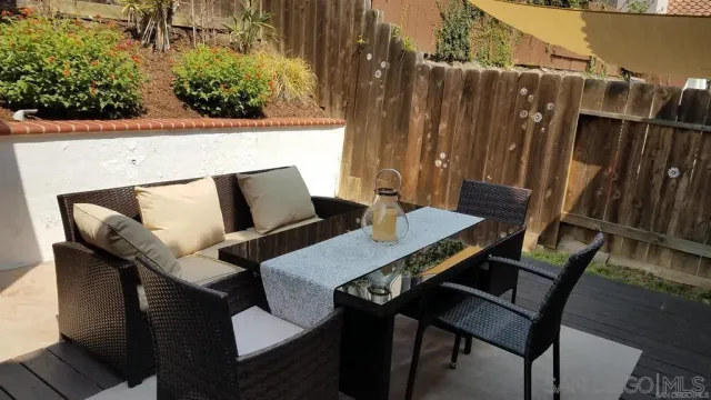 a terrace of a house with outdoor seating