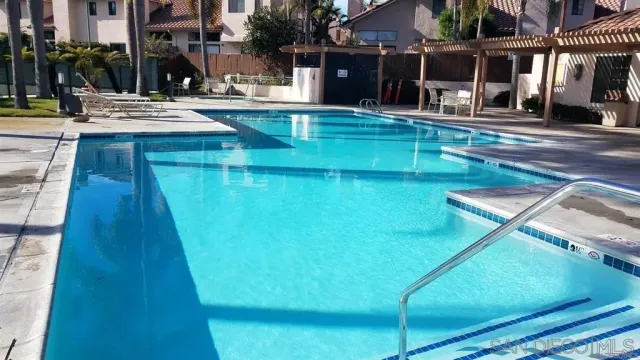 a view of a swimming pool with a patio