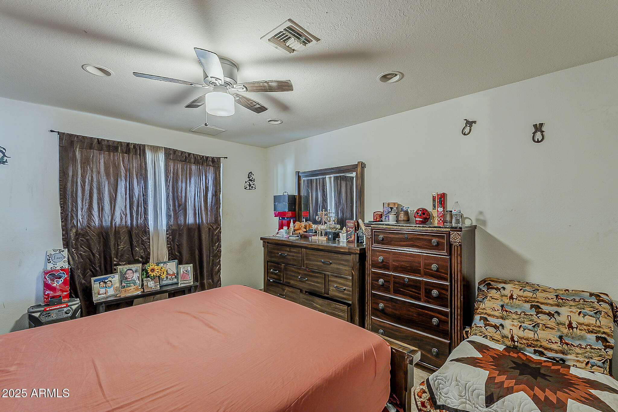 5319 West Osborn Road Phoenix, AZ 85031 - Photo 20 of 37 a bed room with a bed and a dresser