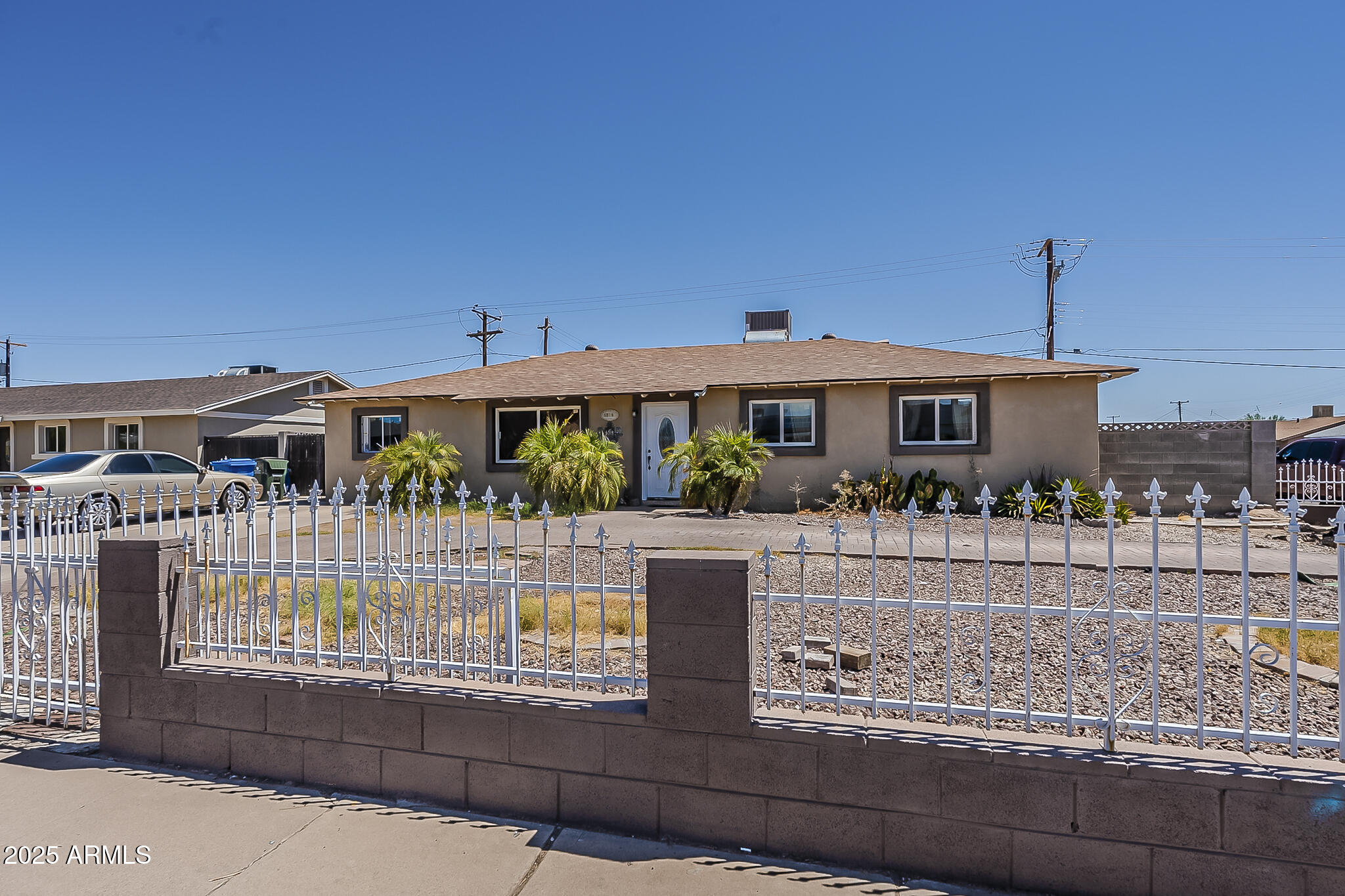 5319 West Osborn Road Phoenix, AZ 85031 - Photo 2 of 37 a front view of a house with balcony