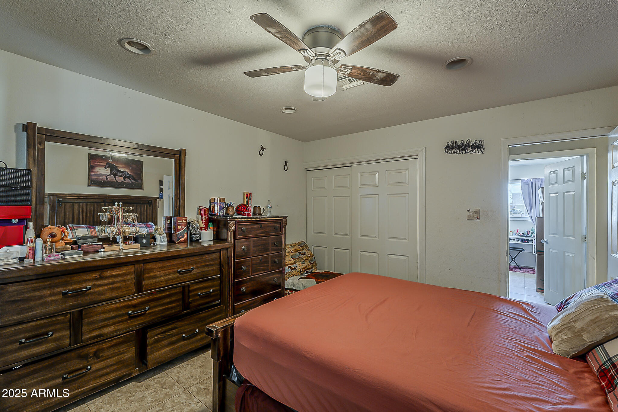 5319 West Osborn Road Phoenix, AZ 85031 - Photo 22 of 37 a bedroom with a bed and a chandelier