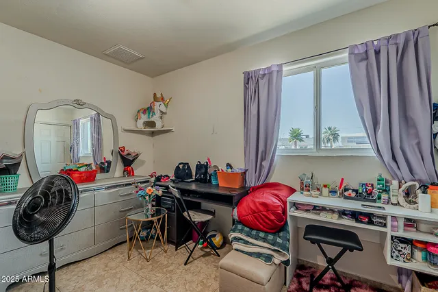 a bedroom with a bed and toys