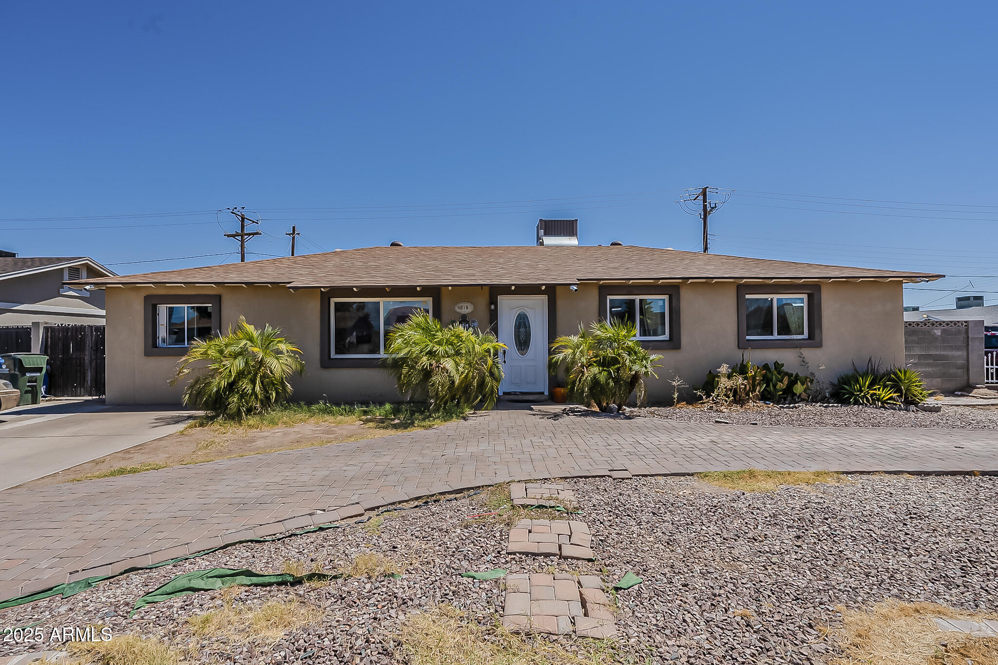 5319 West Osborn Road Phoenix, AZ 85031 - Photo 3 of 37 a front view of a house with a yard