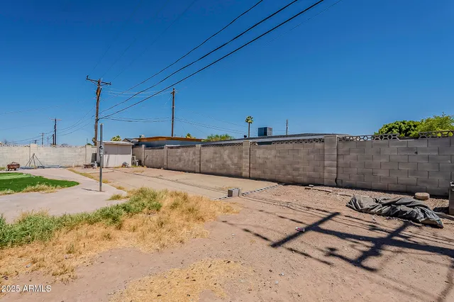 a view of a house with snow on the road