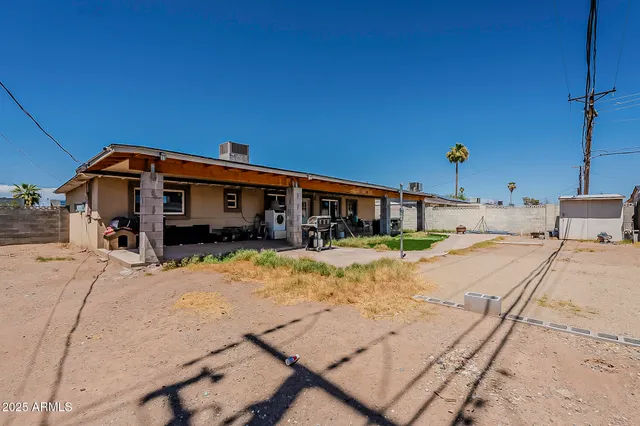 a view of an house with a swimming pool and a yard