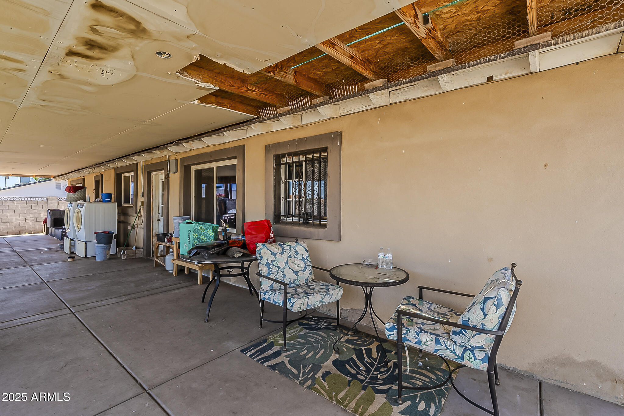 5319 West Osborn Road Phoenix, AZ 85031 - Photo 35 of 37 a view of a patio with table and chairs and potted plants