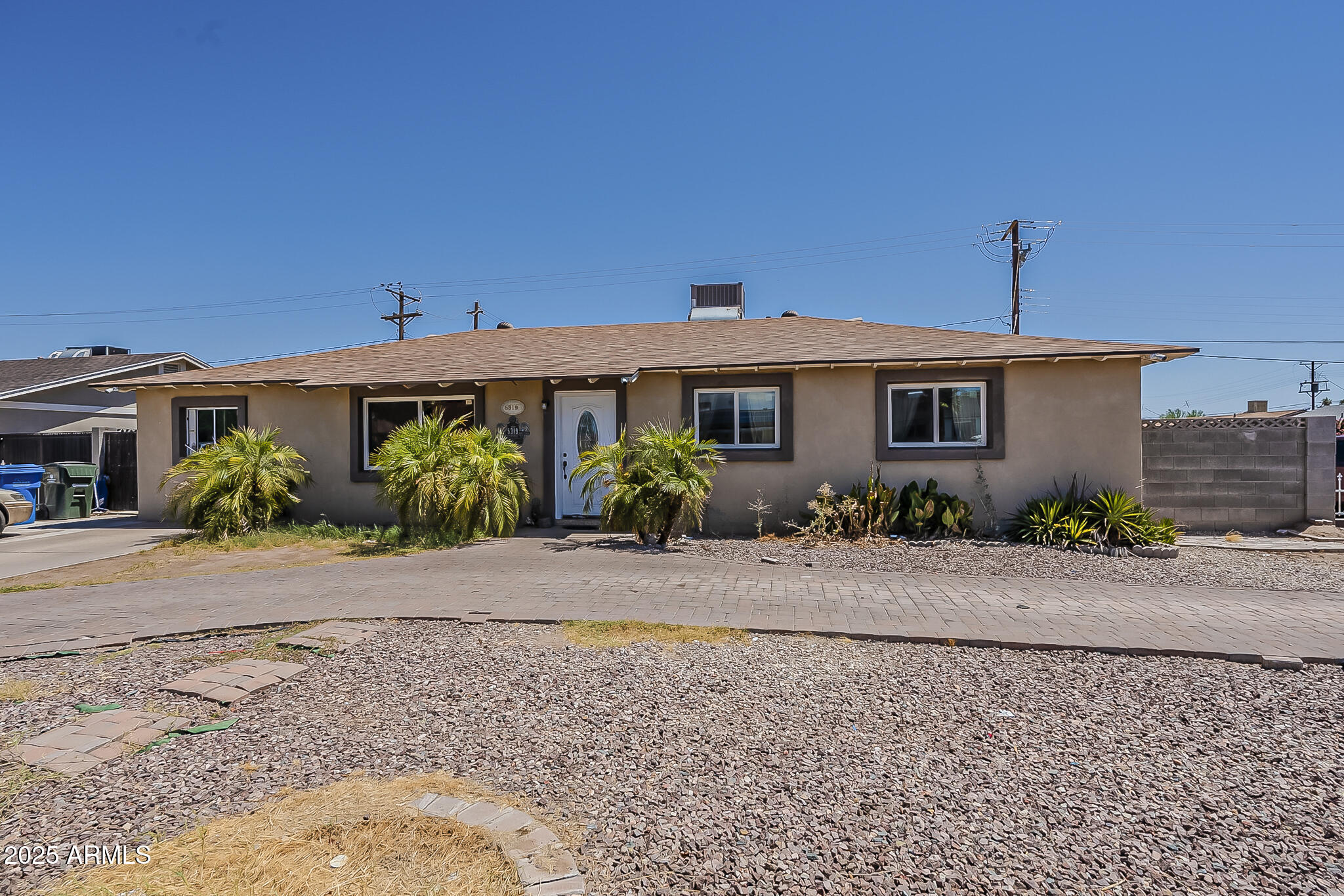 5319 West Osborn Road Phoenix, AZ 85031 - Photo 4 of 37 a front view of a house with a yard