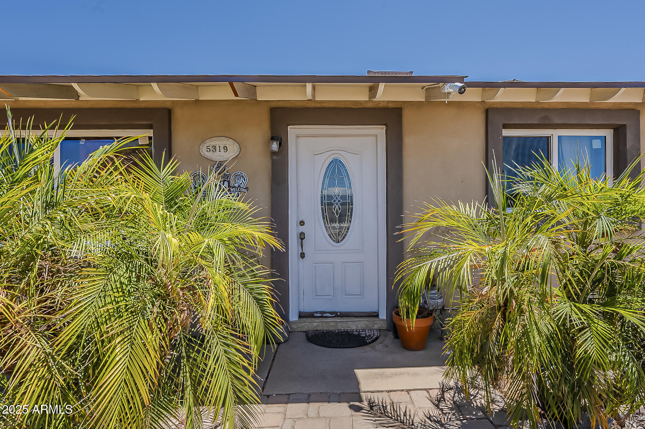5319 West Osborn Road Phoenix, AZ 85031 - Photo 6 of 37 a front view of a house with garden